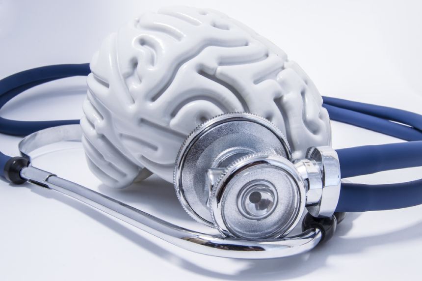 White model of brain surrounded by blue stethoscope