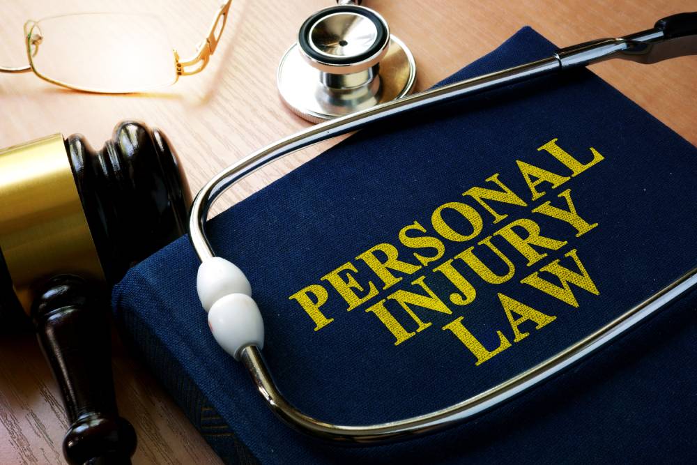 Personal injury textbook with gavel and stethoscope